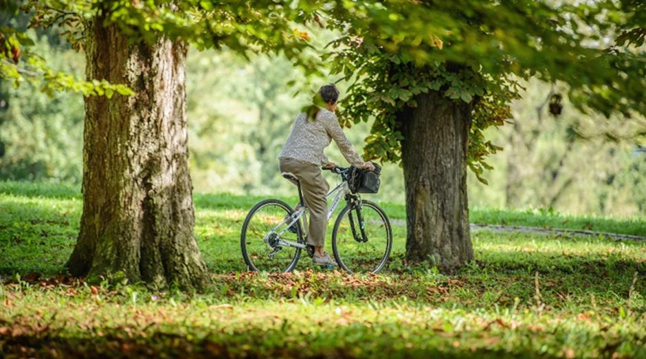 A woman bking in the park